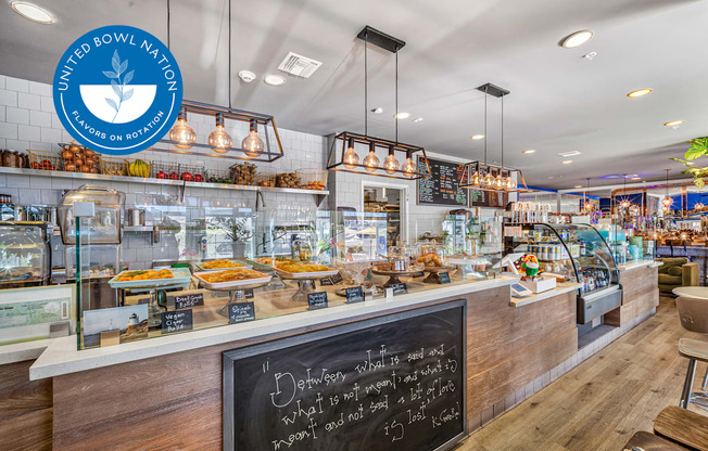 A bakery interior with a chalkboard sign that says at Esprit Marina del Rey, 90292