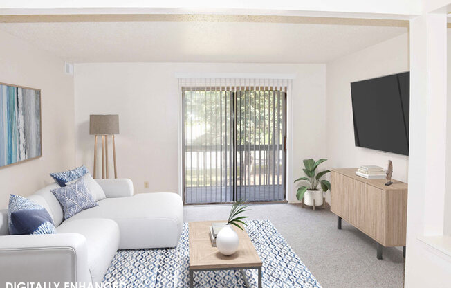 living room with a sliding glass door at Seville Apartments in Kalamazoo, MI 49009