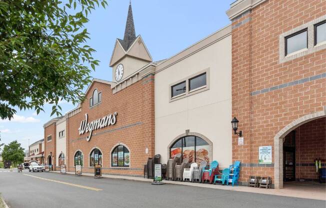 a store with a clock tower on the side of a building