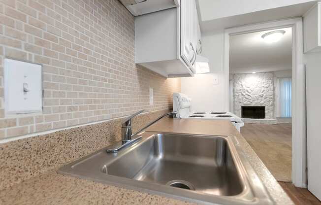 This is a photo of the kitchen in the 751 square foot 1 bedroom, 1 bath apartment at Woodbridge Apartments in Dallas, TX.