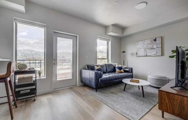 an open living room with a couch and a tv