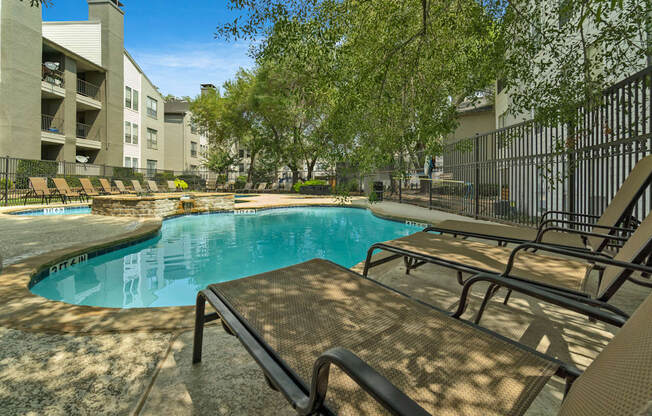 our apartments have a resort style pool and lounge chairs