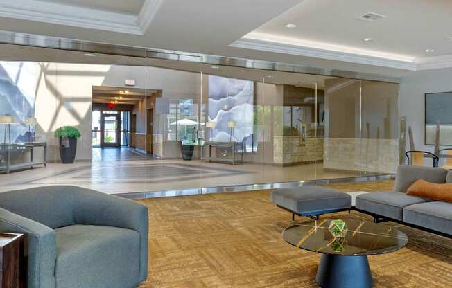 a lobby with couches and chairs and a table at The Rays at Vegas Towers Apartments, Las Vegas
