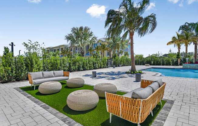 Pool Lounge Area at The Gallery Luxury Apartments in Trinity, FL
