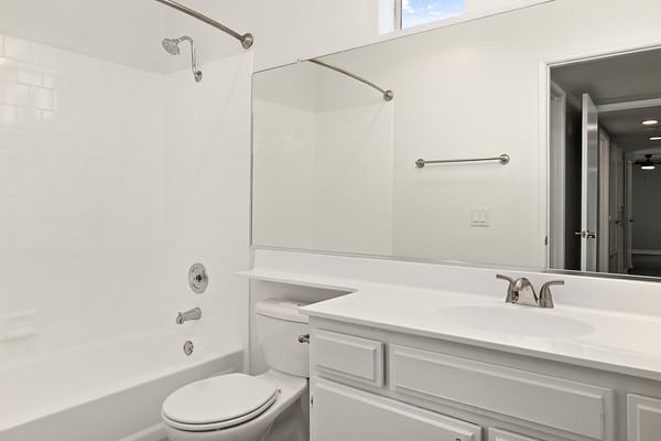 a bathroom with a sink toilet and a mirror at NOHO GALLERY Apartments, California