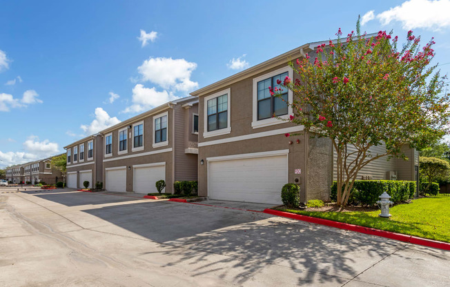 a building with two garages and a street in front of it at Summerwind, Texas