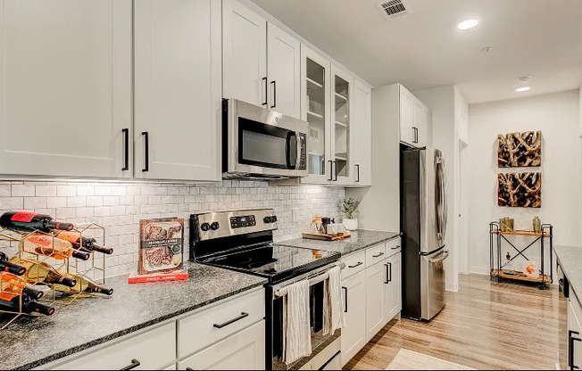 Luxury Grapevine apartment kitchen with granite countertops.