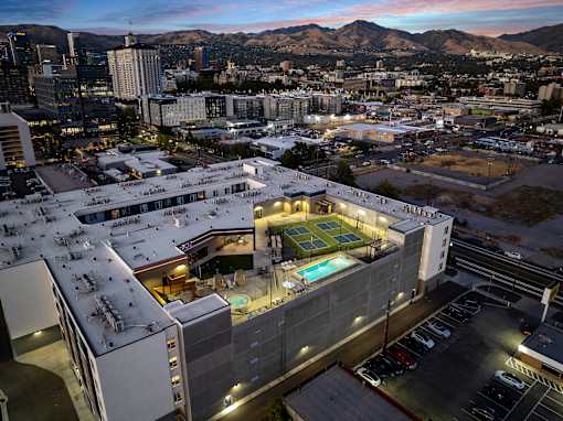 an aerial view of a building with a tennis court on top of it at SevenO2 Main Apartments, Salt Lake City