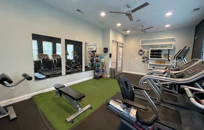 Fitness center with free weights at Oasis at Cedar Branch in Wilmington, NC