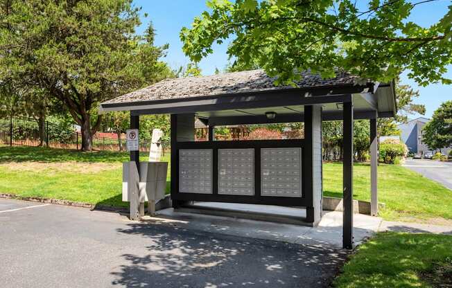 a bus stop with a shelter on the side of a road at Eagles Landing Apartments, Everett, WA