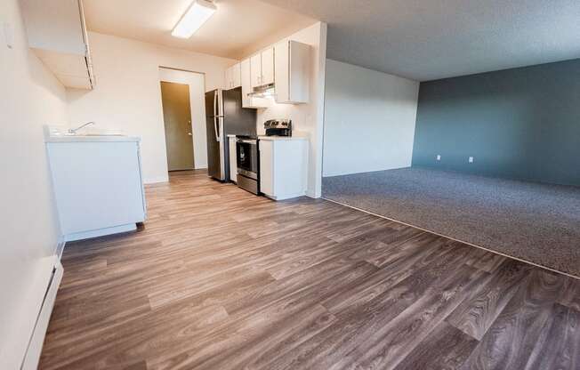 Lakewood Apartments - Arbor Pointe Apartments - Dining Room, Kitchen, Entryway, and Living Room