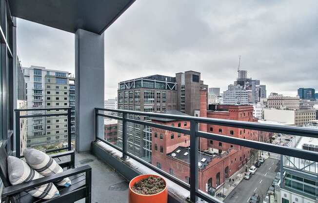 a view of the city from the balcony of a apartment