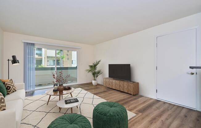 a living room filled with furniture and a large window