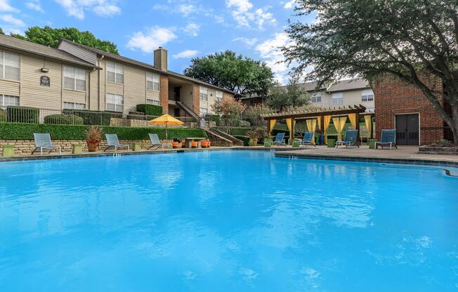 community pool with yellow umbrellas
