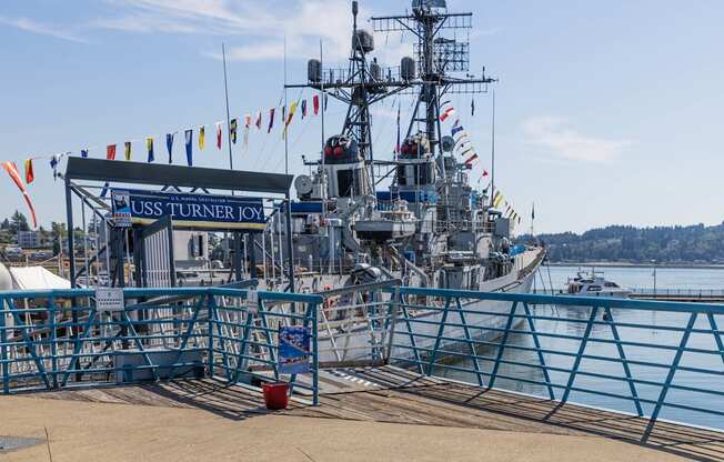 A large ship named USS Turner Joy is docked at a pier at Spyglass Hill Apartments, Bremerton, 98337