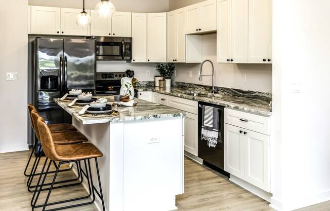 Large stylish kitchens with stainless steel appliances at Edge 204 Apartments in Omaha, NE