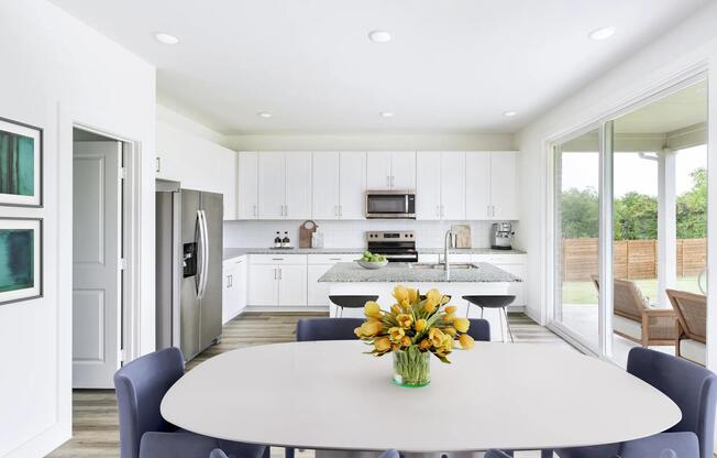 Sleek finishes and spacious design define this Amavi Celina kitchen, opening effortlessly to a large patio ideal for outdoor dining and gatherings.