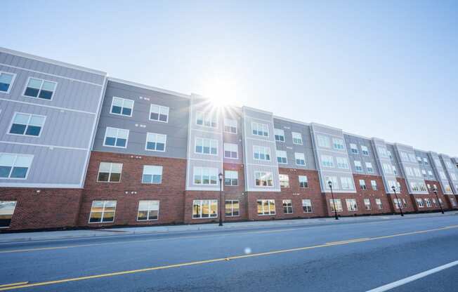 a building with the sun shining in front of it