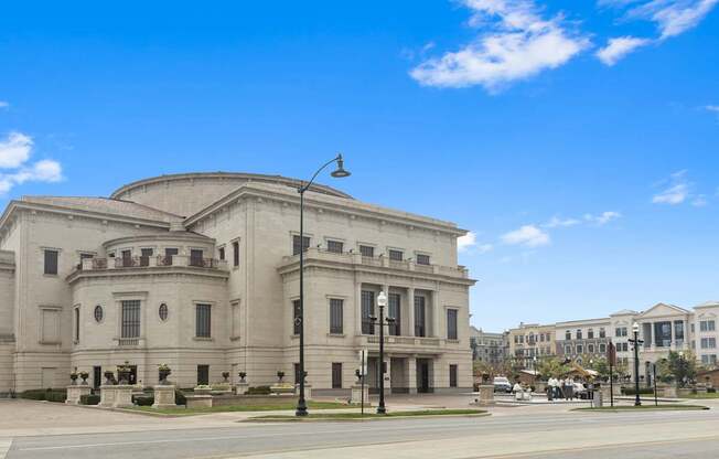 a large white building on the corner of a street