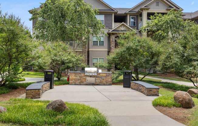 A large house with a driveway and a gate.