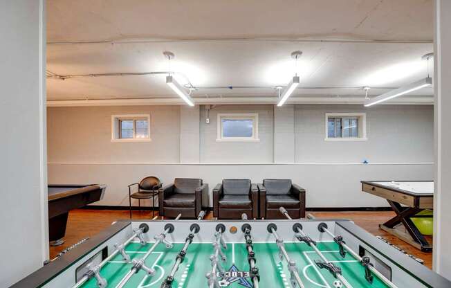 Game room with a foosball table at Mason Hall in Alexandria, VA 22314