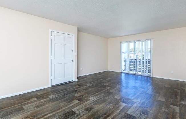 LUXURY WOOD LAMINATE FLOORING IN YOUR LIVING SPACE AT THE CROSSINGS AT 66TH APARTMENTS