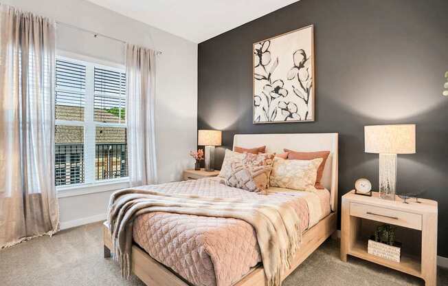 A Bedroom With a Window and Curtains at The Aster Apartments, Cary, NC, 27519