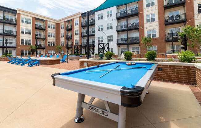 Hang out and get in a game at the pool table in the courtyard.