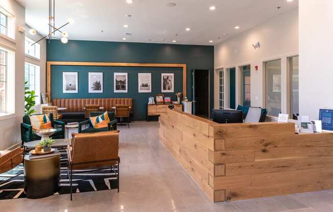a lobby with a reception desk and chairs