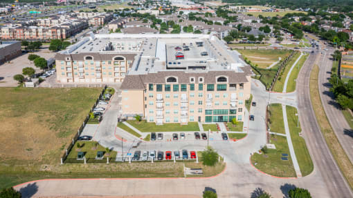 an aerial view of building with car parking at Residences at 3000 Bardin Road, Grand Prairie, 75052