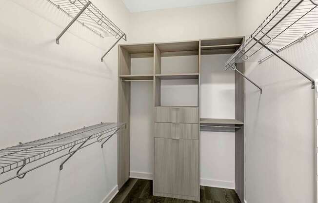 A walk-in closet with shelving and hanging space.
