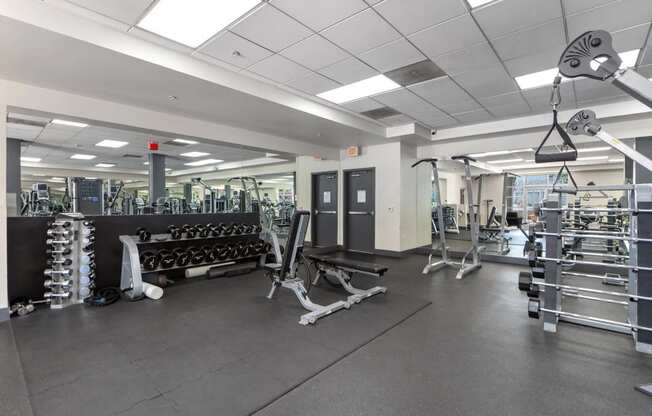 the weights room in the fitness center at the boulevard apartments in