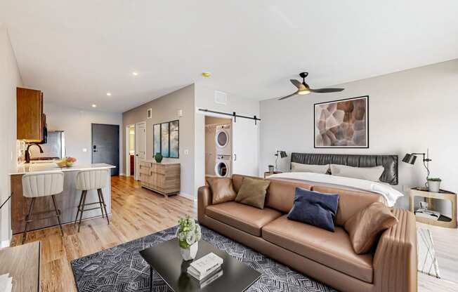 a living room with a couch and a bed