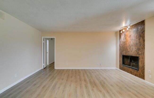 Modern 2-Bed Condo with Fireplace, Balcony & Designer Touches!