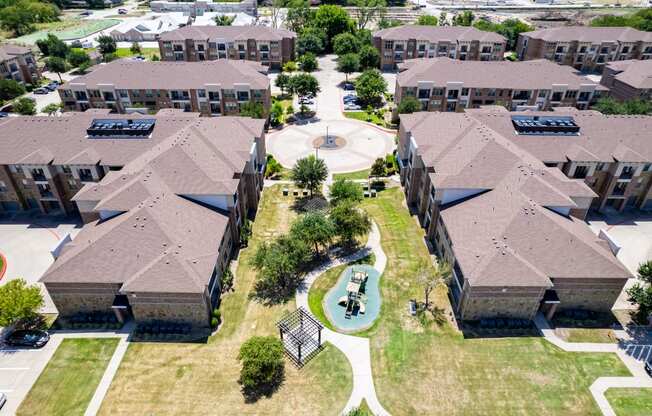 an aerial view of a neighborhood with houses and a playground at Discovery at Craig Ranch, McKinney, TX