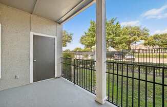 balcony outlook with metal fence and grass