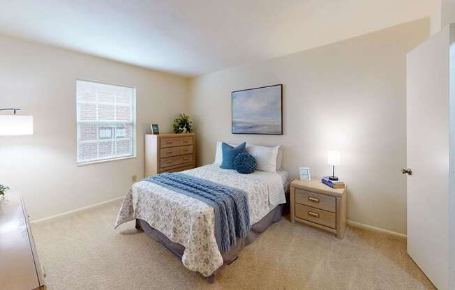 a bedroom with a window and walk-in closet