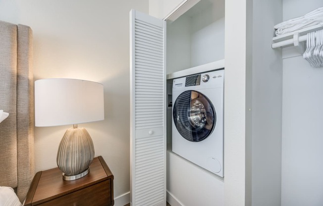 a washer and dryer in a bedroom