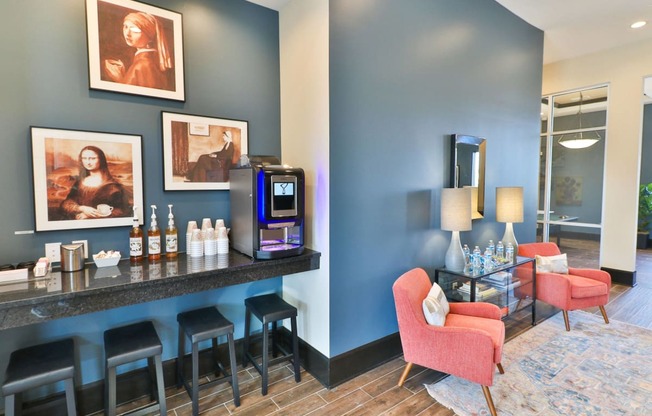 a hotel lobby with a bar with chairs and a coffeemaker