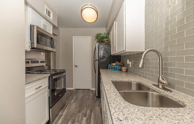 a kitchen with a sink and a window