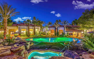 A beautifully lit pool in the evening.
