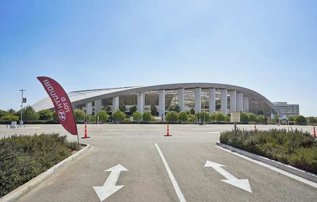 A large building with a red banner that says "ENTRANCE" in front of it.
