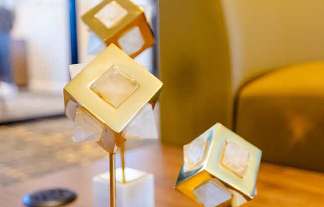 a group of geometric statues on a table in a living room