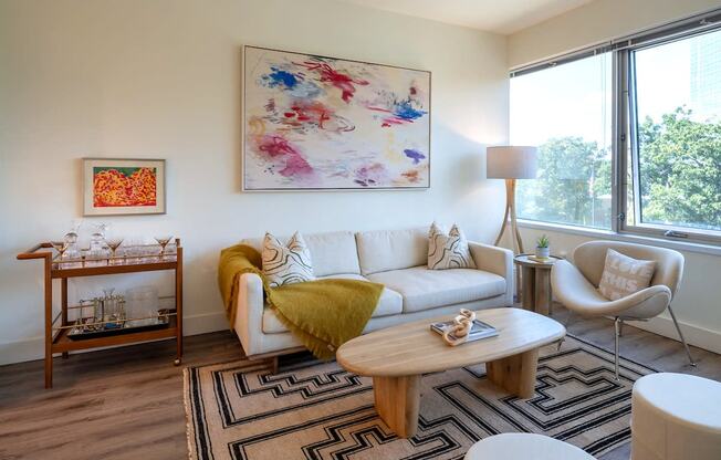 a living room with a couch and a table at Sinclaire on Seminary, Virginia