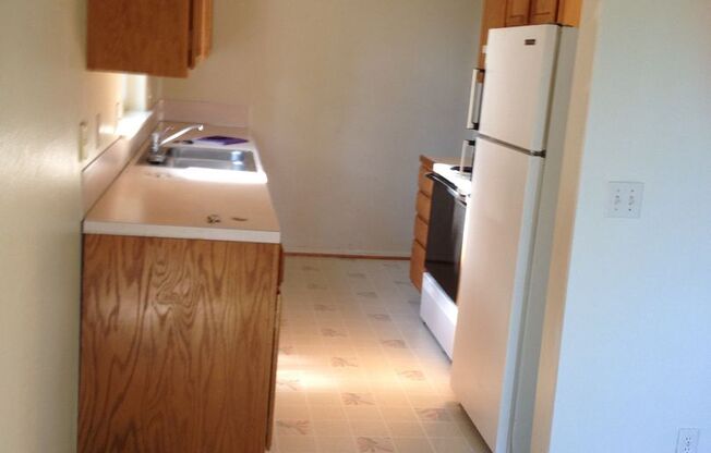Four Bedroom w/ fenced yard, large garage