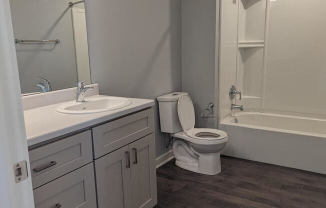 a bathroom with a sink toilet and a shower