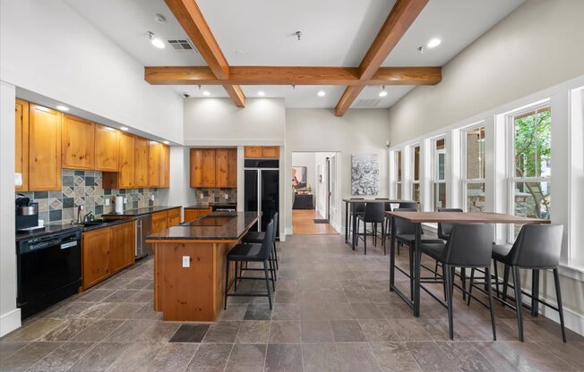 A kitchen with wooden cabinets and a black stove top oven.