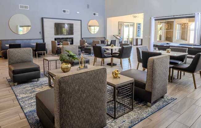 Clubhouse with plenty of seating, pool table, and fireplace.