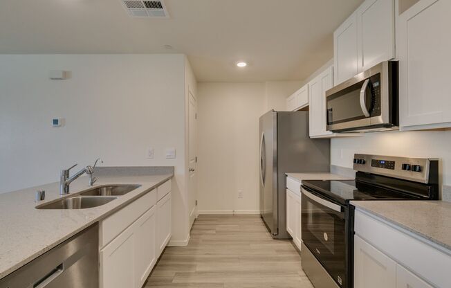 Gorgeous Townhome with upgrades in gated community* 3 large bedrooms, 2 car garage*Community pool, park, tennis courts pluse more*