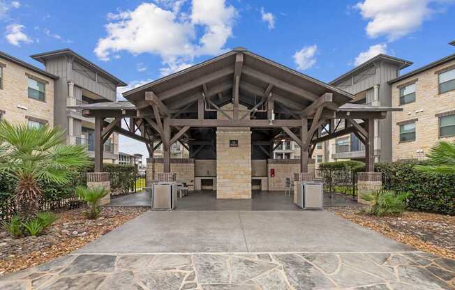 A large stone and wood covered entrance to a building.